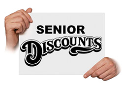 Hands holding sign reading'Senior Discounts'.